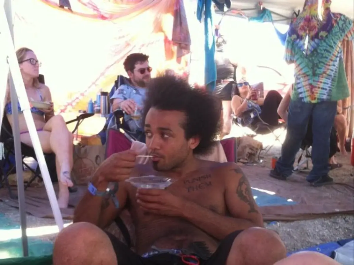Crvne enjoying a bowl of yogurt at a music festival.